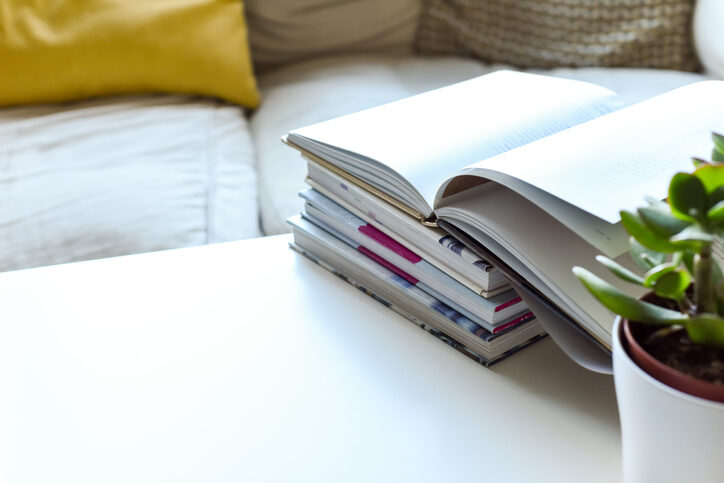 Relaxing sofa area with coffee table and hot drink in modern home interior